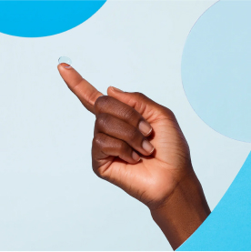 Hand with a Warby Parker Contact