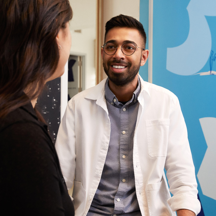 Friendly optometrist in a white coat