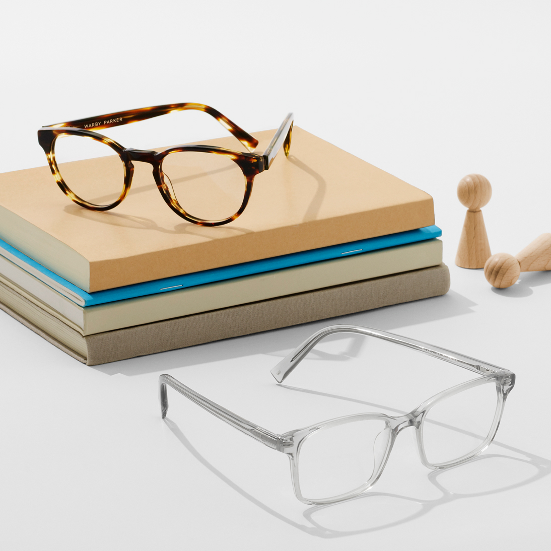 Glasses sitting on a stack of books