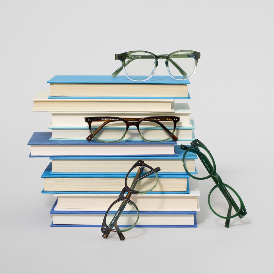 Glasses frames with stack of books