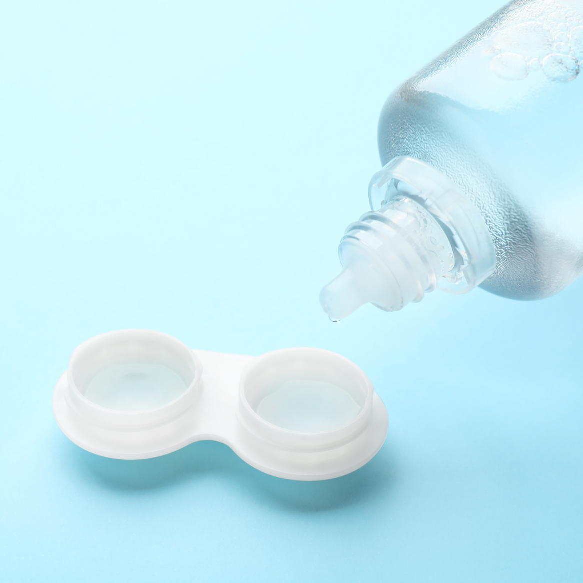 Contacts in storage case with bottle of solution
