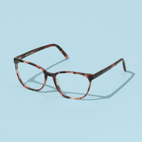 Pair of glasses on light blue background.