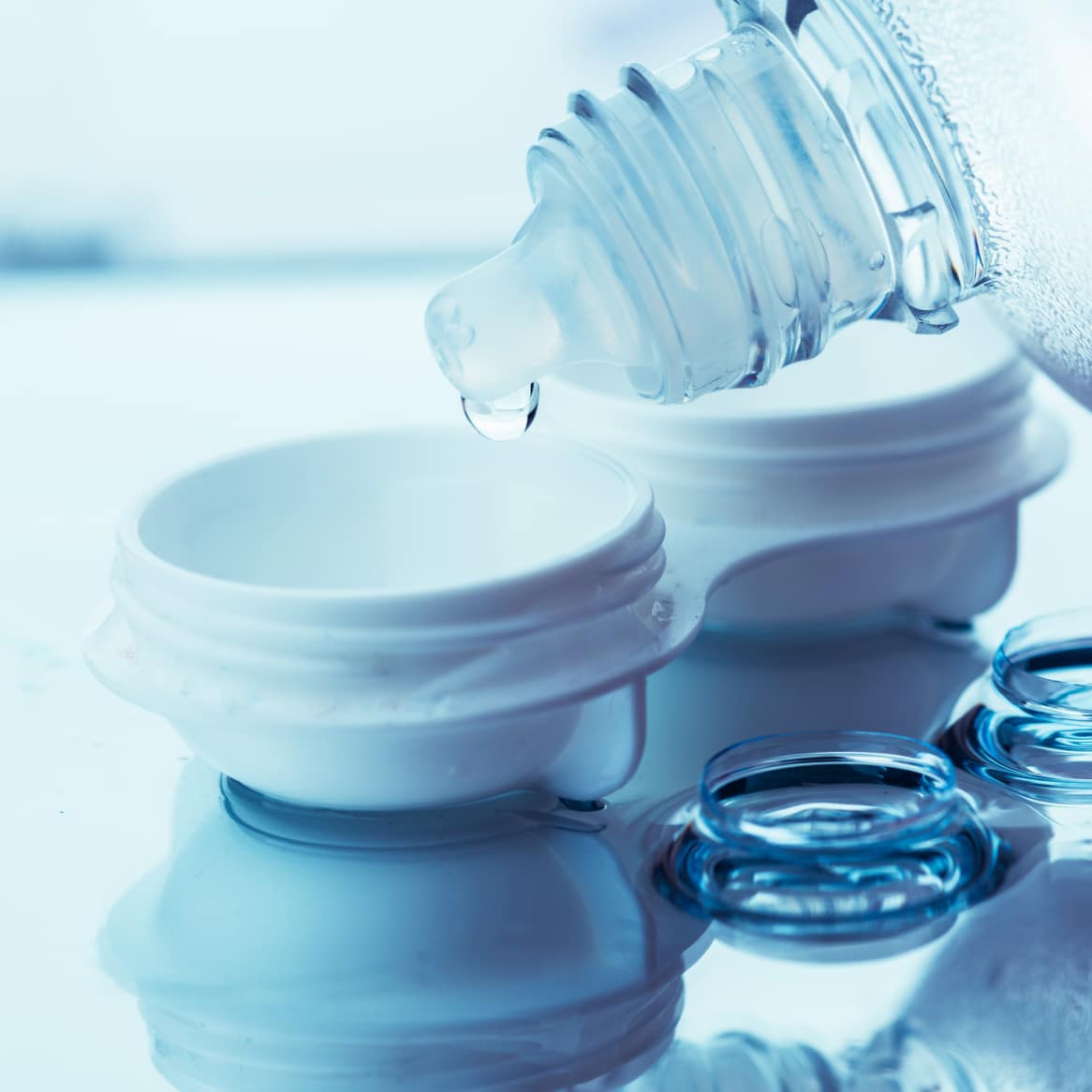 Image of a contact lens case being rinsed with sterile contact solution