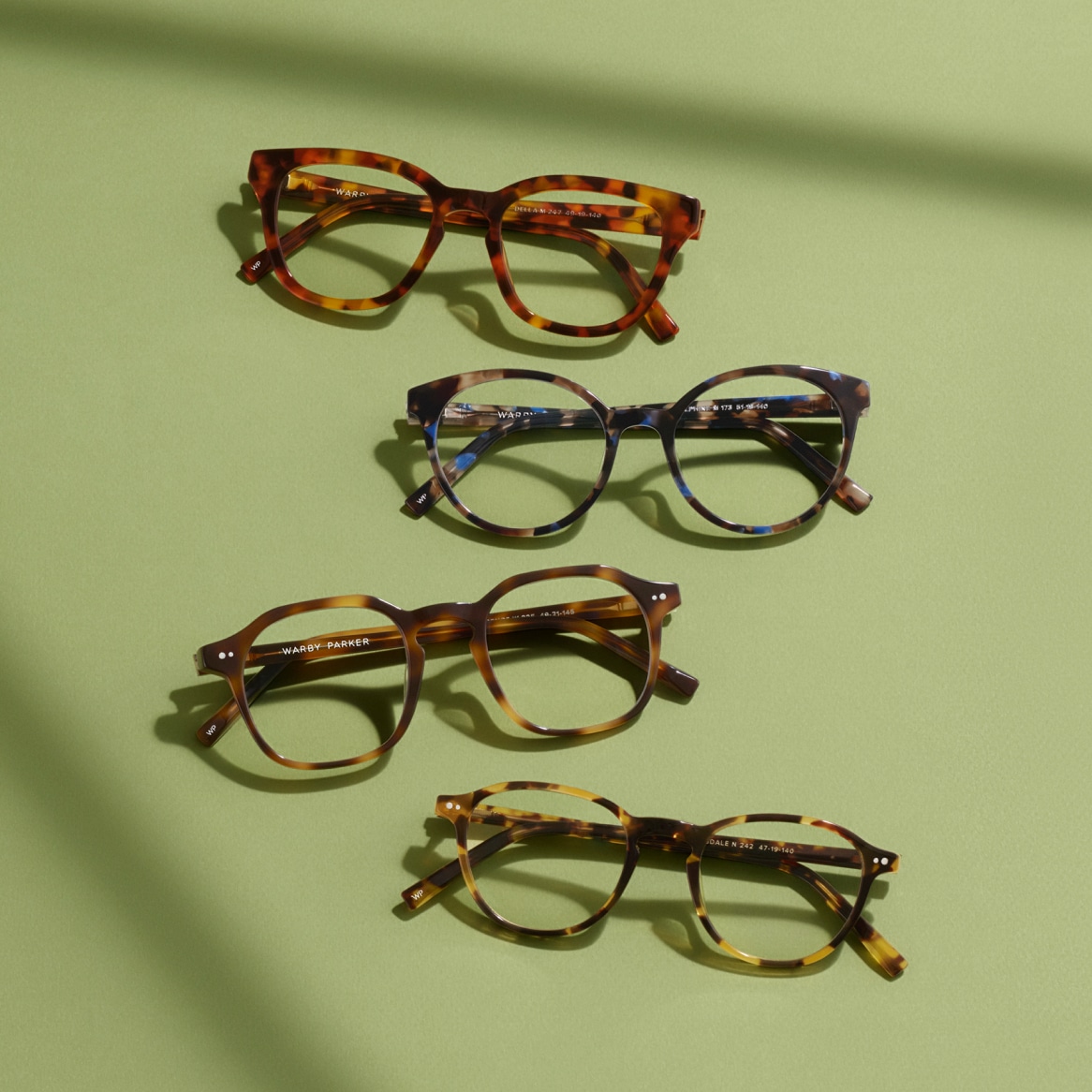 image of glasses on green background