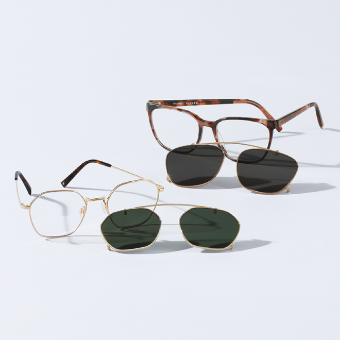 Two pairs of eyeglasses and two pairs of sunglasses