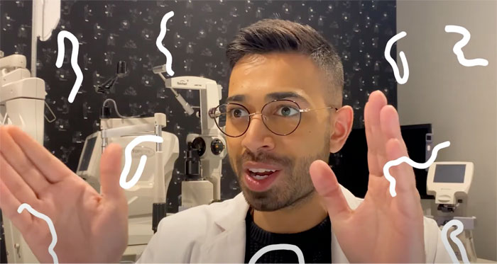 Optometrist with illustration of eye floaters