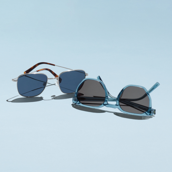 How to choose sunglasses - two pairs of sunglasses on blue background.