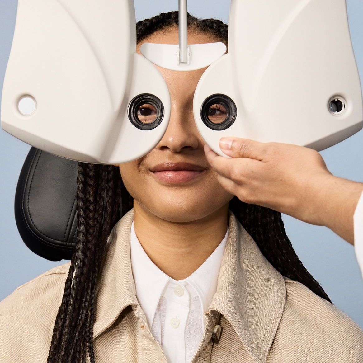 Someone sitting having an eye exam