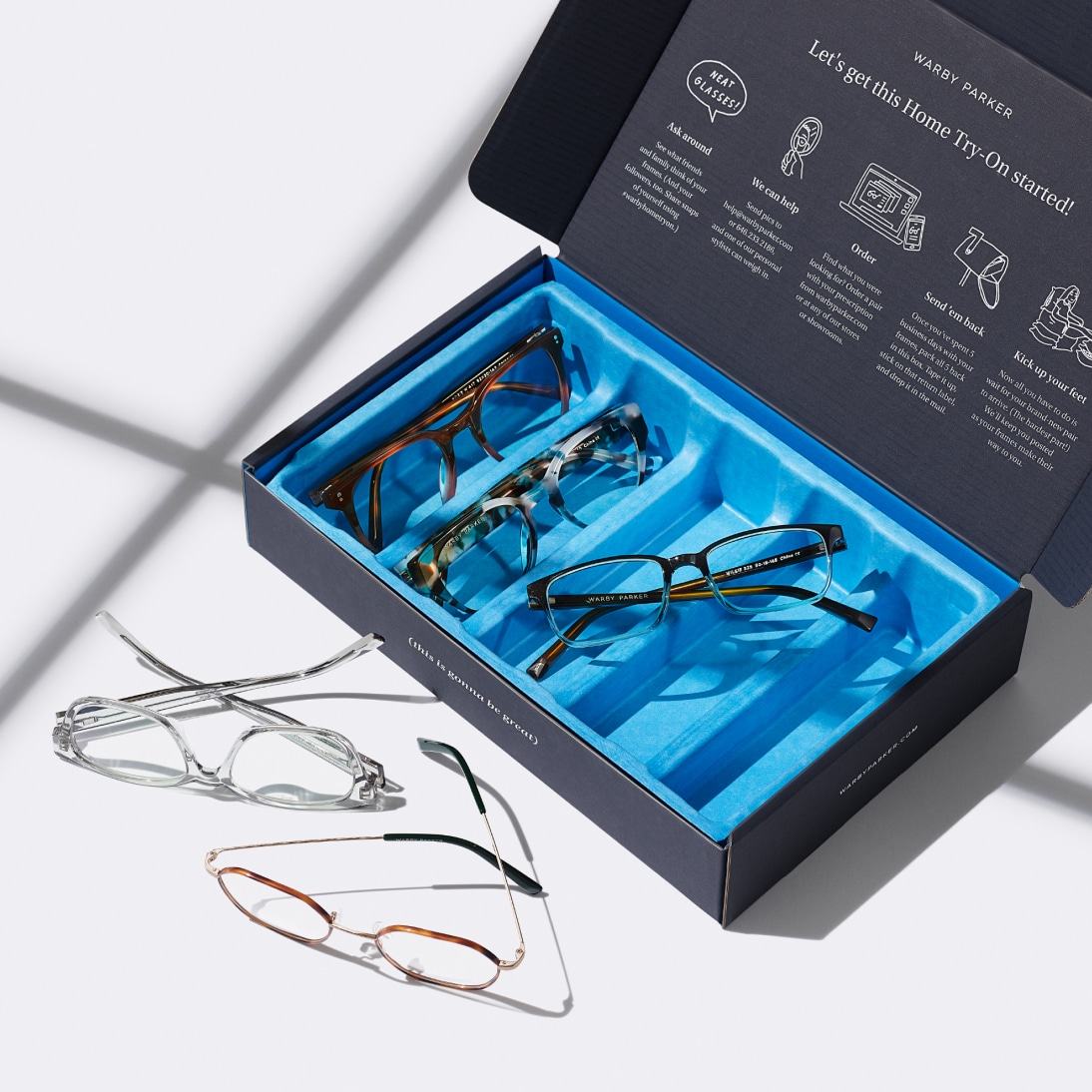Various glasses frames in a box designed to send frames to your home for home try-on